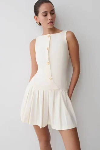 Mackenzie Sleeveless Pleated Mini Dress – Ivory Mackenzie Sleeveless Pleated Mini Dress – Ivory